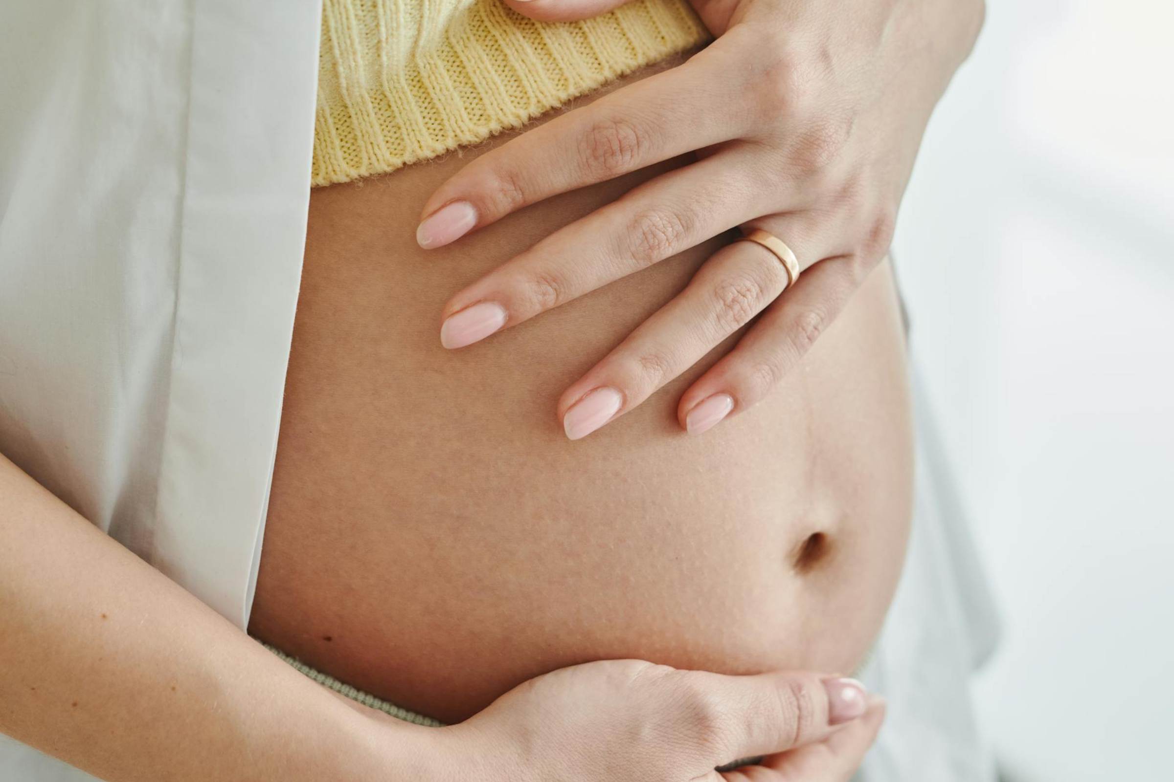 Pregnant woman after acupuncture and IVF support in Hamilton.